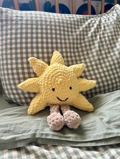 a stuffed starfish laying on top of a bed