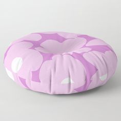 a pink and white flower pattern floor pillow