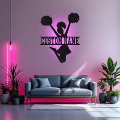 a cheerleader wall decal with the word custom in black on a pink background