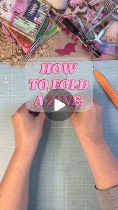 a person is cutting paper with scissors on top of it and the words how to fold a zine