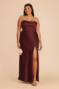 a woman in a long burgundy dress