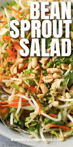 a bowl filled with bean sprout salad and carrots