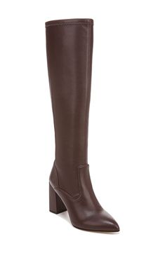 Classic and versatile, this boot is sure to be a fave thanks to a back zipper for easy on-and-off styling along with a pointed toe that gives you legs for days. 3 1/2" heel 15 1/4" shaft; 12 3/4" calf circumference Synthetic upper and lining/rubber sole Imported Interview Boots, High Shaft Faux Leather Boots For Fall, Medium Width High Shaft Boots For Work, Sleek High-shaft Boots For Fall, Workwear High Shaft Boots With Stacked Heel, Sleek Brown Boots For Workwear, Sleek Tall Boots For Fall, Fall Leather Tall Platform Boots, Fall Leather Platform Boots