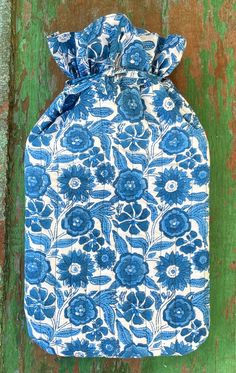 Blue Sunflower Quilted Hot Water Bottle Cover. Hand block printed on certified organic cotton. Super soft, cosy and practical. Drawstring top. Approx 7.5 inches wide x 14 inches long (including above the drawstring).  Our tiny workshop in Rajasthan, India has been producing duvet covers, pillowcases, tablecloths, nightwear, wash bags and hankies for us for over 25 years. Ten years ago we started searching out organically grown cotton and now everything we make is made from certified organic cotton. Quilted Hot Water Bottle Cover, Tiny Workshop, Blue Sunflower, Sunflower Quilts, Hot Water Bottle Cover, Water Bottle Covers, Drawstring Top, Hot Water Bottle, Bottle Cover