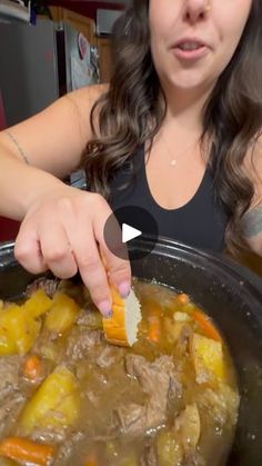 a woman is stirring some food in a pot