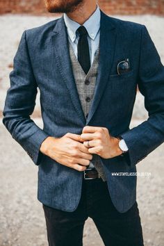 Something as simple as teaming a dark blue sportcoat with black jeans can potentially set you apart from the crowd. Shop this look for $129: http://lookastic.com/men/looks/blazer-waistcoat-tie-long-sleeve-shirt-jeans-belt/7438 — Navy Blazer — Grey Plaid Waistcoat — Black Tie — Light Blue Long Sleeve Shirt — Black Jeans — Dark Brown Leather Belt Terno Slim, Navy Blazers, Style Gentleman, Blue Long Sleeve Shirt, Elegante Casual, Wedding Suits Men, Affordable Wedding