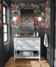 a bathroom with green and orange wallpaper on the walls, two sinks and a mirror