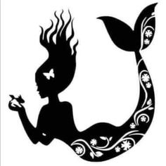 a silhouette of a mermaid holding a butterfly