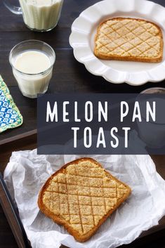 two pieces of toast sitting on top of a pan next to a glass of milk