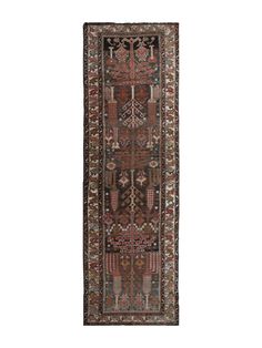 an antique persian runner rug with geometric design and fringes on the edges, in dark brown