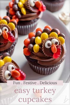 cupcakes with chocolate frosting decorated like turkeys and candy candies on top