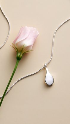 A tear-shaped pendant in recycled sterling silver on a snake chain. Happy Tears, A Snake, Recycled Sterling Silver, Snake Chain, Long Necklace