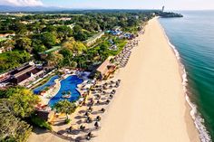 an aerial view of the beach and resort