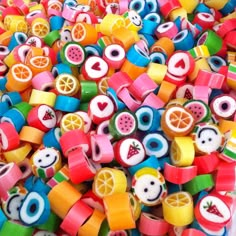 there are many colorful beads with fruit on them