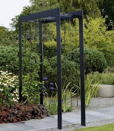 an outdoor garden with flowers and plants in the background