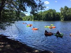 many people are in kayaks on the water