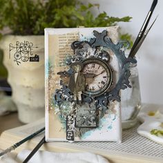 an altered clock sitting on top of a book