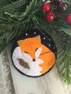 a felt ornament with a fox on it