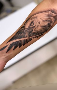 an eagle tattoo is shown on the arm