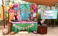 an outdoor party with decorations on the table