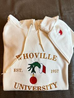 Christmas Hoodie, Christmas Whoville University Embroidered Hoodie, Christmas Gift, Christmas Embroidery Hoodie, Christmas Crewneck 90% cotton, 10% polyester * Unisex Hoodies fits men & women great. * All sizes are available in the following (S, M, L, XL, 2X, 3X) If needed larger or smaller please send us a quick email to get it in stock for you. * Your custom Artwork/LOGO is digitally digitized and embroidered with best in class embroidery machines. * THE PERFECT GIFT: Many of our designs make these Hoodies the best gift for those important moments. Also you can use some of these designed hoodies to identify your company members or friends crew. * RICHLY STYLED HOODIE: made from 90% cotton, 10% polyester that gives the shirt a fresh, and moisture wicking performance. Our about 6.5 OZ cott Christmas Whoville, Whoville University, Embroidery Hoodie, Christmas Crewneck, Embroidery Gifts, Christmas Hoodie, Christmas Hoodies, Style Hoodie, Soft Hoodie