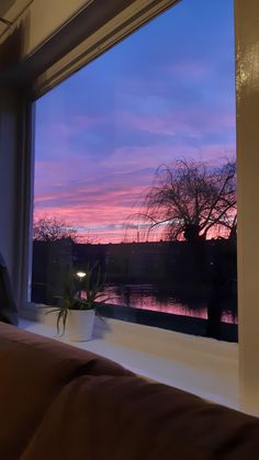 a window with a view of the sunset