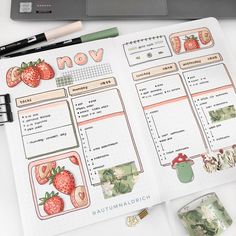 an open planner with strawberries on it