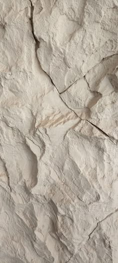 a close up view of a rock with cracks in it