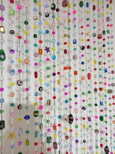 the beads are hanging on the wall in the room