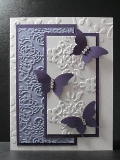 a white card with purple butterflies on it