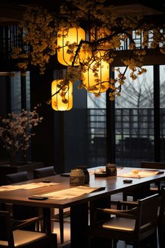 a dining room table and chairs with lights hanging from the ceiling