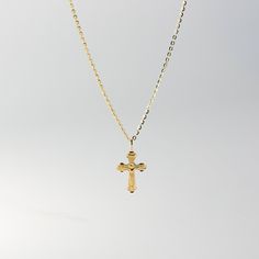 This is the perfect religious pendant to wear if you're looking for a crucifix necklace that shows nothing but Jesus and His act of love for the world. Neat and simple, you will be reminded of how Jesus Christ sacrificed His life for your sins. This 14K solid gold Catholic crucifix pendant will be a simple reminder for you or someone you love of Jesus and His unconditional love. Pair it with a fine gold chain and wear it close to your heart. The religious piece is 100% tarnish-free and will radi Dainty Crucifix Necklace With Adjustable Chain, Cross Pendant Charm Necklace With Adjustable Chain, Spiritual Cross Necklace With Adjustable Chain, Yellow Gold Crucifix Necklace With Clavicle Chain, Spiritual Cross Charm Necklace With Adjustable Chain, Crucifix Cross Necklace With Clavicle Chain As Gift, Spiritual Cross Pendant Necklace For First Communion, Engraved Cross Necklace For First Communion, Minimalist Cross Pendant Necklace For First Communion