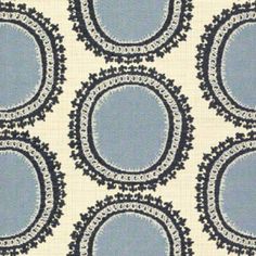 a blue and white fabric with circles on it