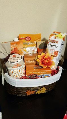 a basket filled with lots of different types of food and condiments on top of a table