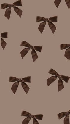 an image of brown bows on a gray background