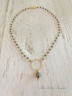 Shimmering “fool’s gold” pyrite stones with a gold filled circle and a pyrite dangle is a simple but stunning statement look. Sixteen inches with a gold filled lobster clasp. Fool’s Gold, Circle Necklace, The Fool, Lobster Clasp, Gold Filled, Stone, Gold