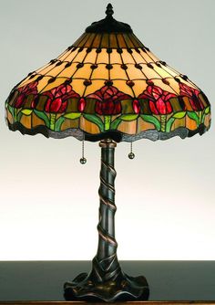 a stained glass lamp on a wooden table