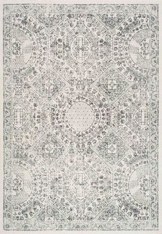 an area rug with grey and white designs on the top, in front of a white background