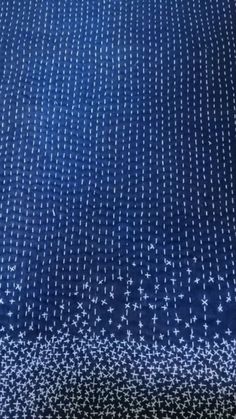 a blue blanket with white stars on it