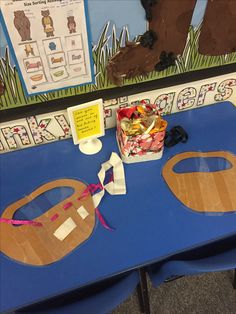 a blue table topped with lots of crafting supplies on top of it's sides