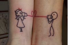 two people with tattoos on their arms, one has a heart and the other has an arrow