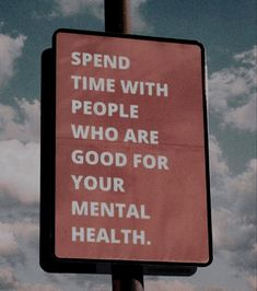 a red sign that says spend time with people who are good for your mental health