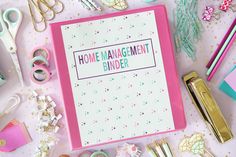 a pink binder with the words home management binder surrounded by crafting supplies