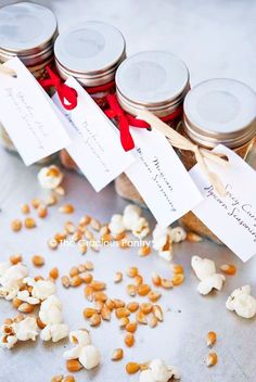 several jars filled with different kinds of food