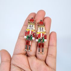 These Beautiful Christmas themed EARRINGS are made of very fine quality of metal and Crystals for Christmas day! The material used in this jewelry are free from Lead, Nickel, Cadmium so it will not give you any skin irritation and environment friendly too.. MEASUREMENTS -these earrings are measure about inches 2.1 long and 0.8 inches wide . ► ABOUT YOUR ORDER * All items are neatly packaged in our beautiful jewelry boxes and elegant organza bags. * All items are 100% gift-ready. * Each order com Red Novelty Christmas Jewelry, Novelty Red Christmas Jewelry, Red Novelty Jewelry For Christmas, Red Christmas Novelty Jewelry, Christmas Novelty Silver Jewelry, Novelty Christmas Jewelry For The Holidays, Novelty Christmas Holiday Jewelry, Christmas Holiday Novelty Jewelry, Green Nutcracker