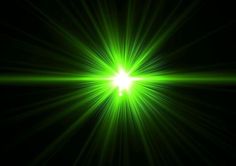 bright green light shines brightly in the dark sky, creating a star like effect