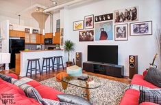 a living room filled with furniture and a flat screen tv