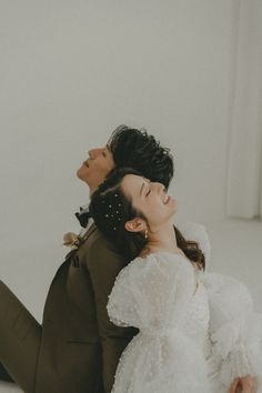 a man and woman laying on the ground