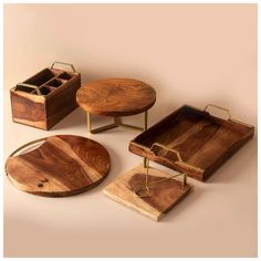 three wooden trays with compartments on each side and two small tables in the middle