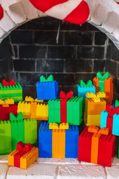 there are many colorful legos on the fireplace